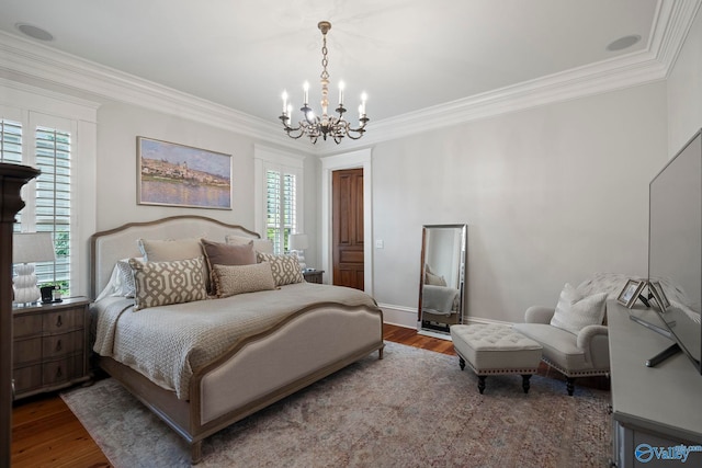 19 Ledges Main SE, Huntsville, AL 35802 - bedroom with a chandelier, crown molding, wood finished floors, and baseboards