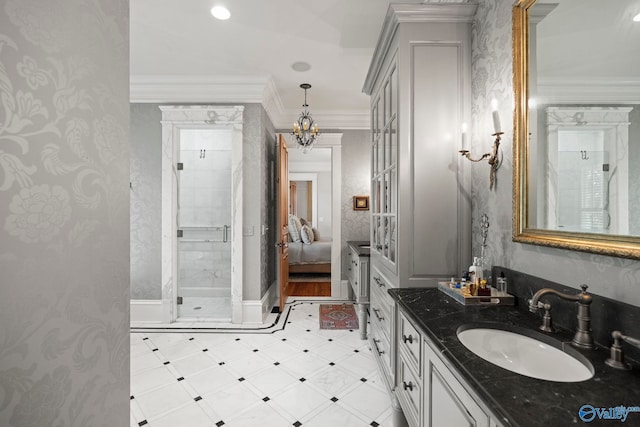 19 Ledges Main SE, Huntsville, AL 35802 - ensuite bathroom featuring crown molding, a stall shower, vanity, a chandelier, and baseboards