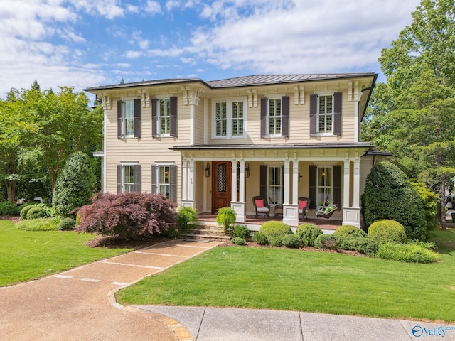 19 Ledges Main SE, Huntsville, AL 35802 - italianate-style house with covered porch, a front yard, a standing seam roof, and metal roof