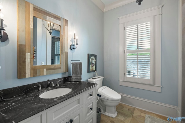 19 Ledges Main SE, Huntsville, AL 35802 - bathroom with vanity, toilet, baseboards, and a chandelier