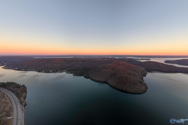 aerial view at dusk with a water view