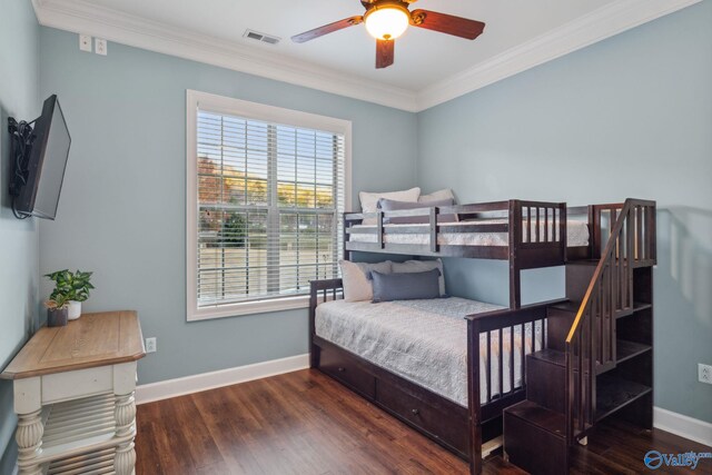 bedroom with dark wood-type flooring and ornamental molding