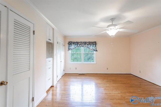 unfurnished bedroom with ceiling fan, light hardwood / wood-style floors, and ornamental molding