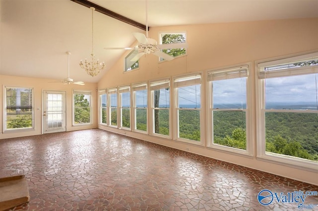 unfurnished sunroom with ceiling fan with notable chandelier and lofted ceiling with beams