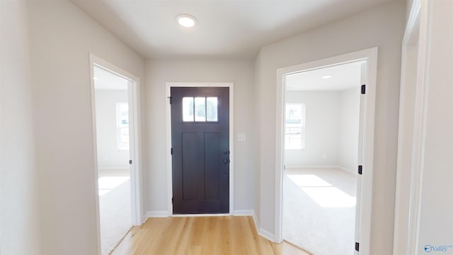 view of carpeted entrance foyer