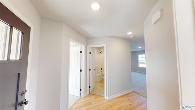 corridor featuring light hardwood / wood-style flooring