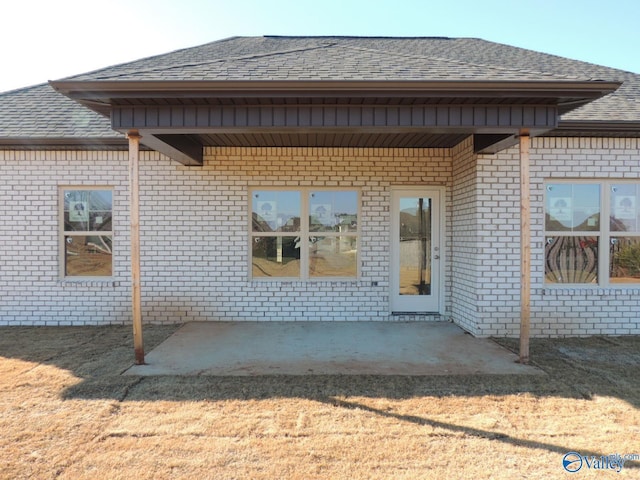 back of house with a patio