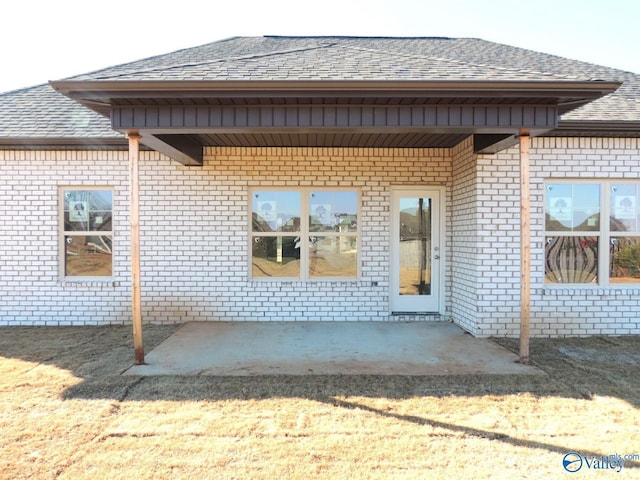 back of house with a patio