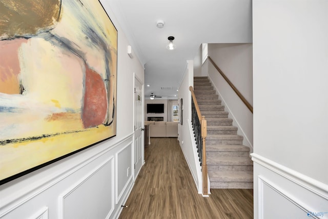 interior space featuring hardwood / wood-style floors and ornamental molding