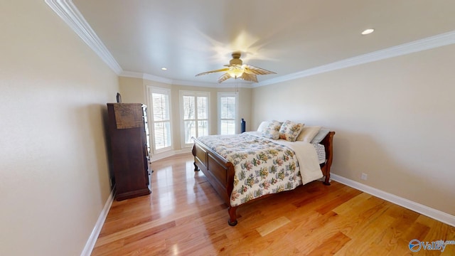 bedroom with light hardwood / wood-style flooring, ceiling fan, and ornamental molding