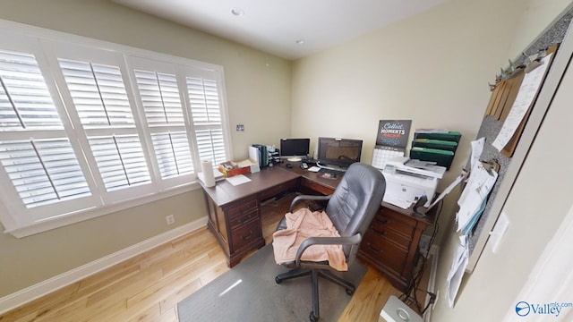 home office with light wood-type flooring