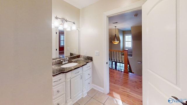 bathroom with vanity and hardwood / wood-style flooring