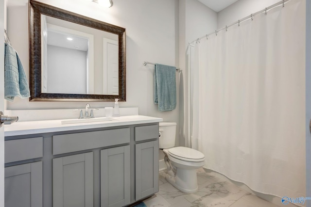 full bathroom featuring a shower with curtain, marble finish floor, vanity, and toilet