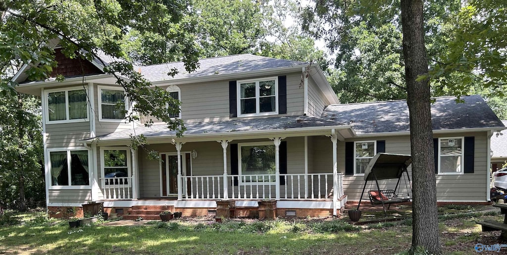10466 Segers Rd, Madison, AL 35756 - view of front facade with covered porch, crawl space, and roof with shingles