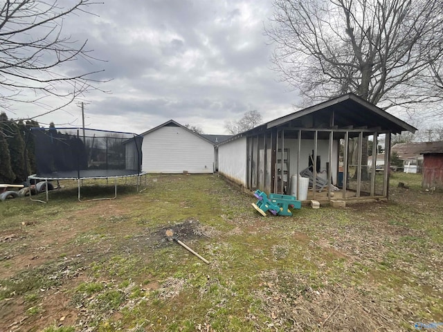 1207 N Houston St N, Athens, AL 35611 - view of grassy yard featuring a trampoline