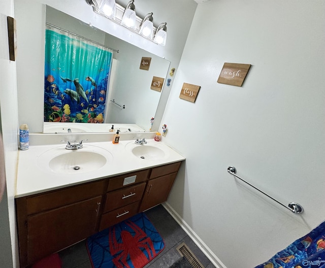 bathroom featuring vanity and tile patterned flooring