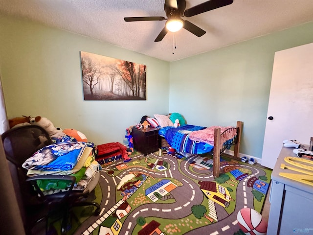 bedroom featuring a textured ceiling and ceiling fan