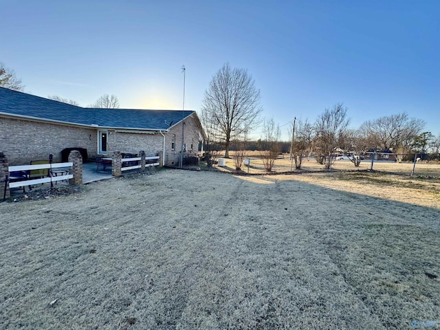 view of yard with a patio and a rural view