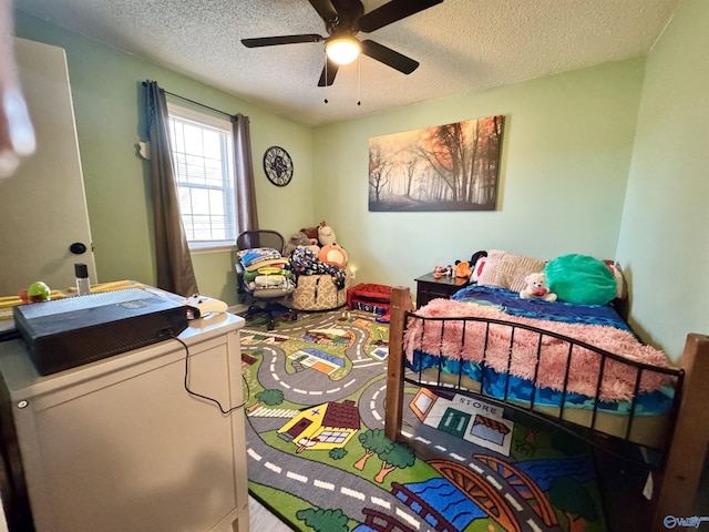 bedroom featuring a textured ceiling and ceiling fan