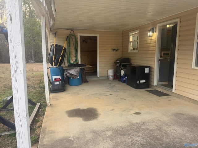 view of patio / terrace featuring an attached carport