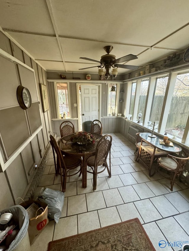 sunroom / solarium with ceiling fan