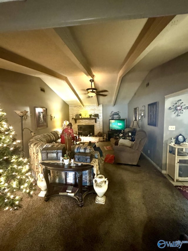 interior space with lofted ceiling with beams, a brick fireplace, and ceiling fan