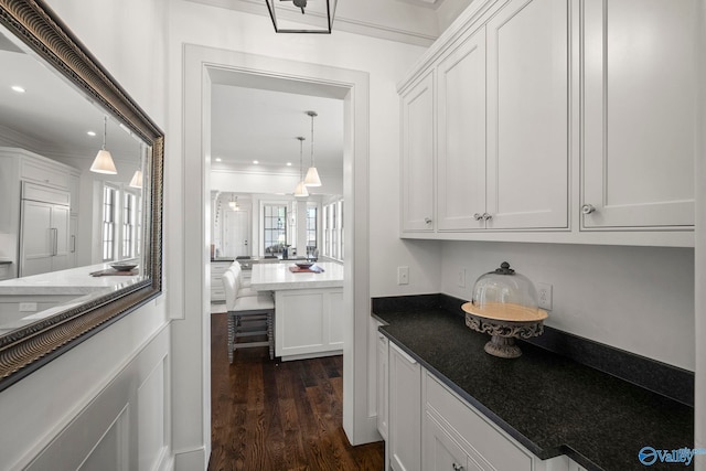 bar featuring decorative light fixtures, dark wood-style floors, recessed lighting, and ornamental molding