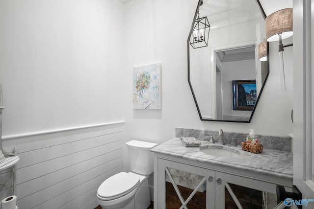 bathroom with toilet and vanity