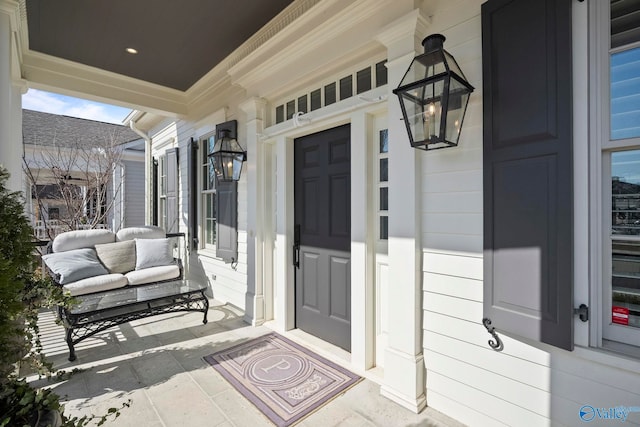 entrance to property with a porch