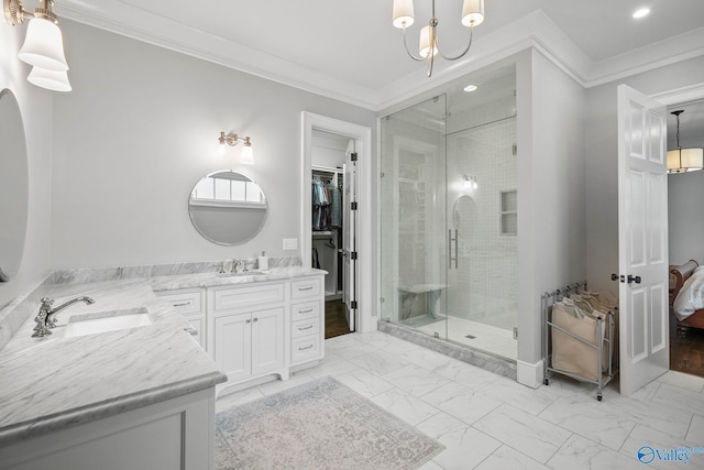 bathroom featuring vanity, recessed lighting, a shower stall, crown molding, and marble finish floor