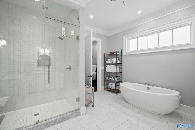 full bath featuring marble finish floor, a stall shower, ornamental molding, baseboards, and a soaking tub