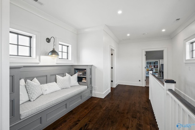 hallway with dark wood-style floors, visible vents, recessed lighting, and crown molding