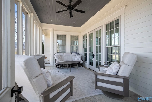 view of patio with an outdoor living space, french doors, and a ceiling fan