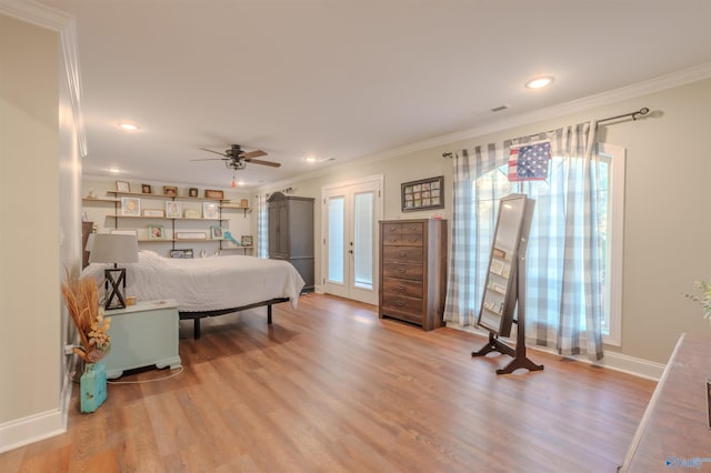 bedroom featuring ornamental molding, ceiling fan, and light hardwood / wood-style floors