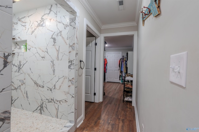 hallway with dark wood-type flooring and ornamental molding