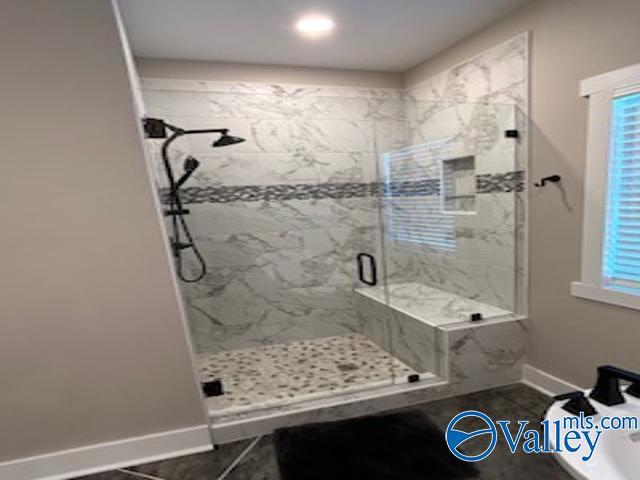 bathroom featuring walk in shower