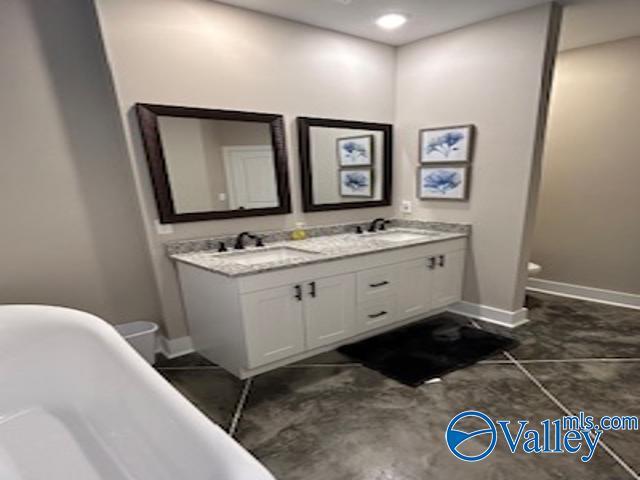 bathroom with vanity and a bathtub