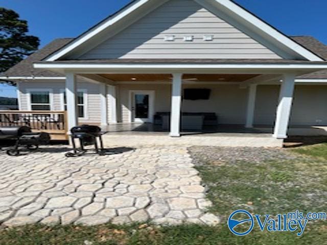 back of property featuring a patio