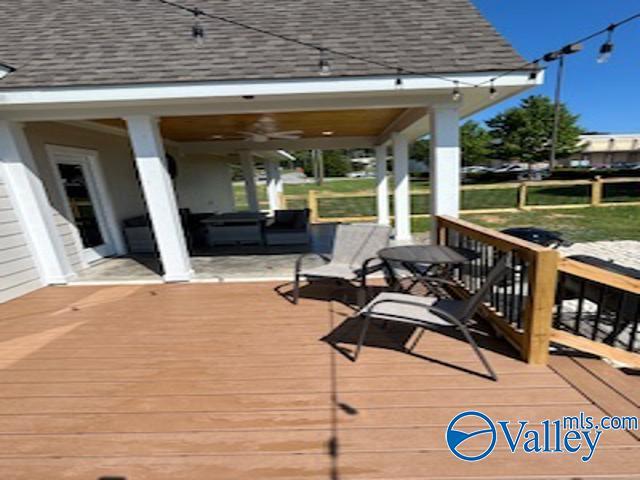 wooden deck featuring outdoor lounge area