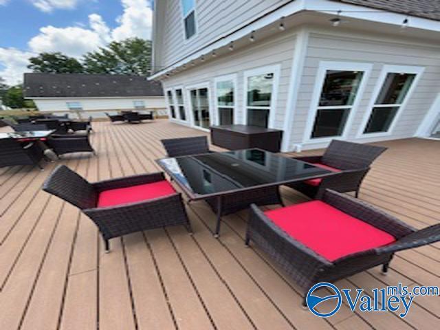 deck featuring outdoor lounge area