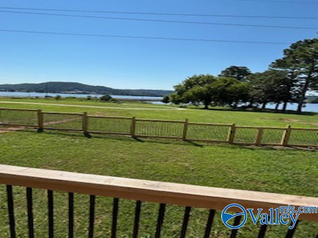 view of yard with a water and mountain view