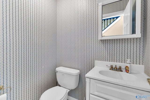152 Old Vaughn Bridge Rd, Hartselle, AL 35640 - bathroom with wallpapered walls, toilet, and vanity