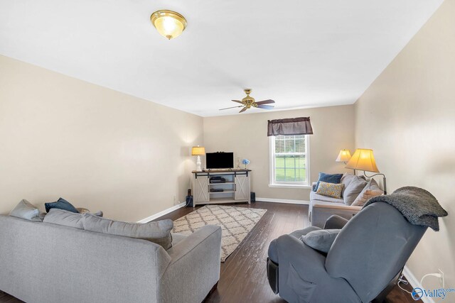 152 Old Vaughn Bridge Rd, Hartselle, AL 35640 - living area featuring baseboards, ceiling fan, and dark wood-style flooring