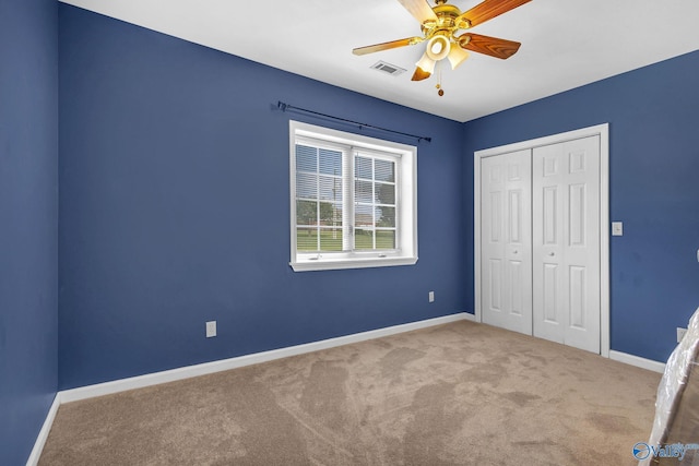 152 Old Vaughn Bridge Rd, Hartselle, AL 35640 - unfurnished bedroom featuring carpet flooring, a closet, baseboards, and ceiling fan
