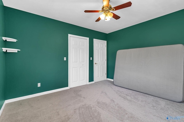 152 Old Vaughn Bridge Rd, Hartselle, AL 35640 - unfurnished bedroom featuring carpet floors, baseboards, a ceiling fan, and a closet