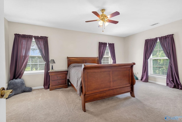 152 Old Vaughn Bridge Rd, Hartselle, AL 35640 - bedroom featuring light carpet, multiple windows, baseboards, and a ceiling fan