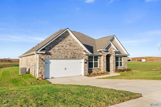 craftsman inspired home featuring a front lawn, concrete driveway, brick siding, and a garage