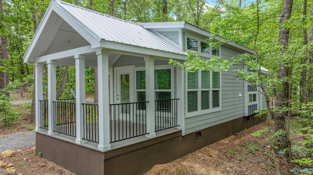 568 County Road 642, Mentone, AL 35984 - view of home's exterior with crawl space, metal roof, and covered porch