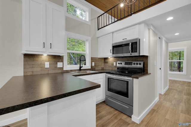 568 County Road 642, Mentone, AL 35984 - kitchen with appliances with stainless steel finishes, a sink, dark countertops, plenty of natural light, and wood ceiling