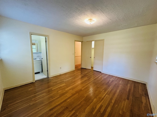 unfurnished bedroom with baseboards and wood finished floors